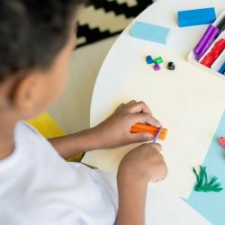 Boy Making Art With Diffrent Colored Clay