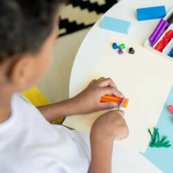 Boy Making Art With Diffrent Colored Clay